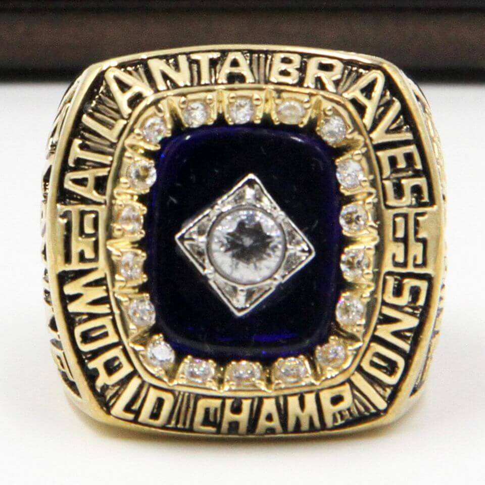 An Atlanta Braves fan shows off a replica World Series ring that